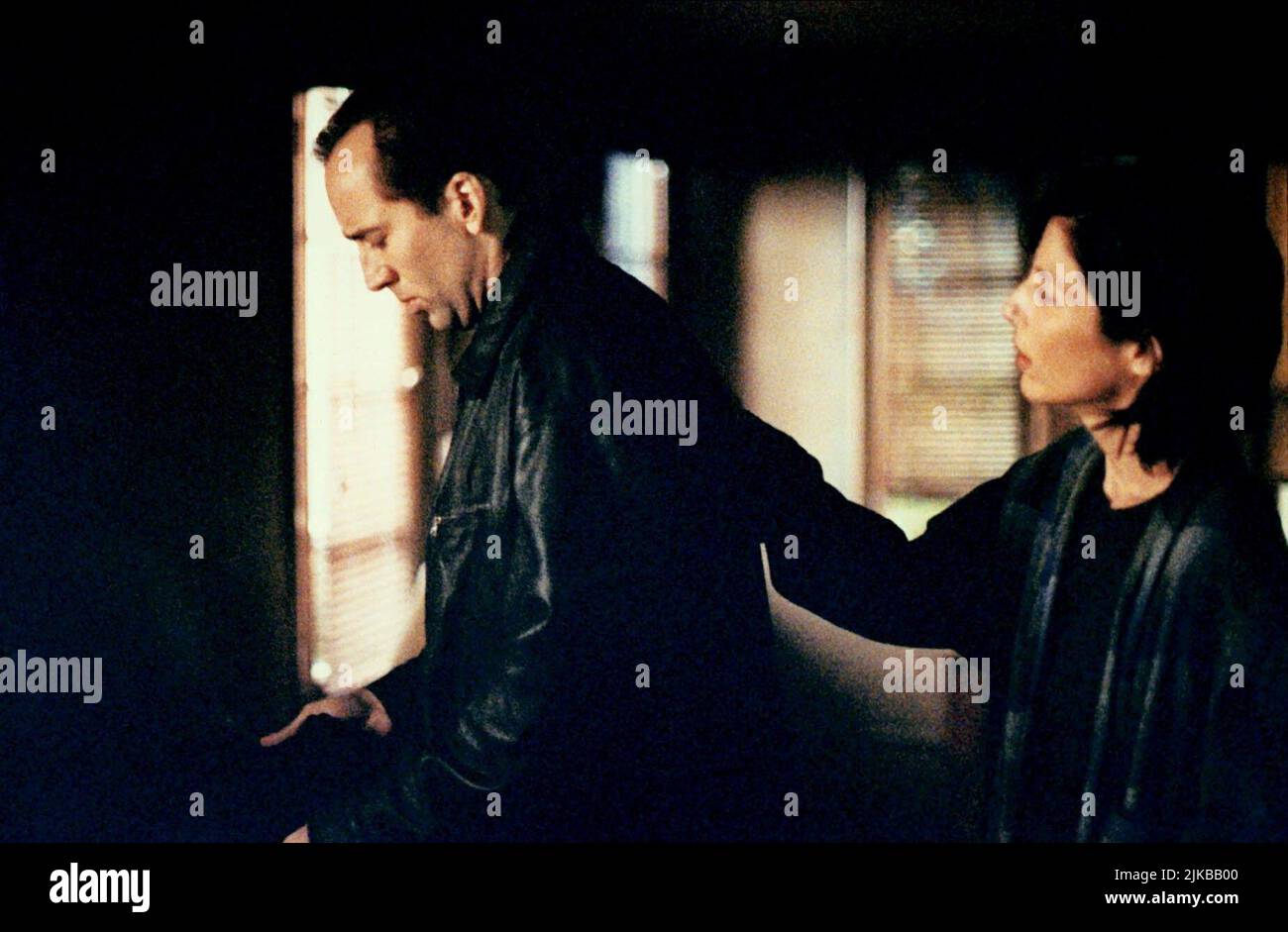 Nicolas Cage & Catherine Keener Film: 8mm (USA/DE 1999) Characters: Tom Welles,Amy Welles  Director: Joel Schumacher 19 February 1999   **WARNING** This Photograph is for editorial use only and is the copyright of COLUMBIA PICTURES and/or the Photographer assigned by the Film or Production Company and can only be reproduced by publications in conjunction with the promotion of the above Film. A Mandatory Credit To COLUMBIA PICTURES is required. The Photographer should also be credited when known. No commercial use can be granted without written authority from the Film Company. Stock Photo