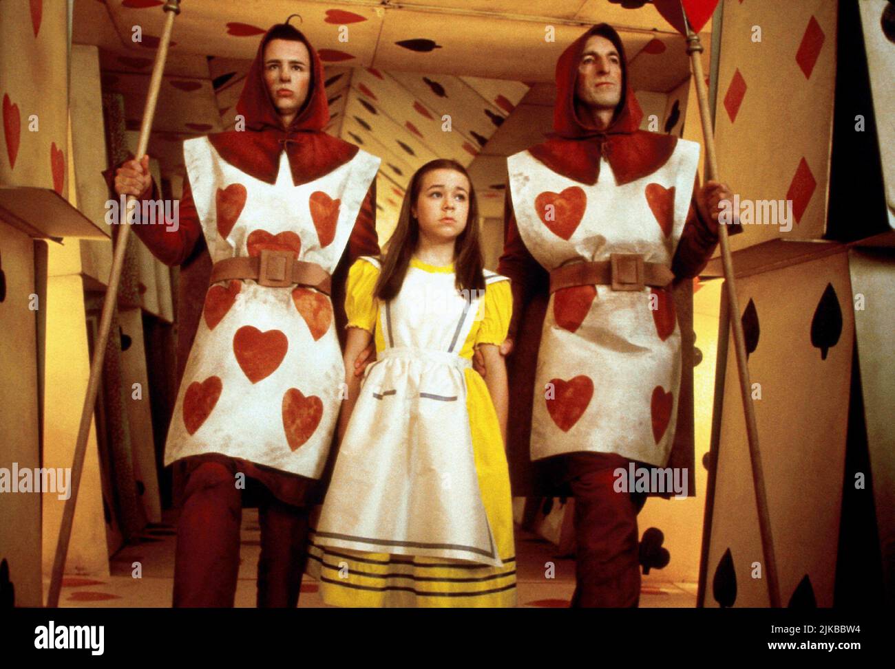 Angus Barnett, Tina Majorino & Tim Potter Film: Alice In Wonderland (1999) Characters: Four Of Hearts,Alice & Three Of Hearts  Director: Nick Willing 28 February 1999   **WARNING** This Photograph is for editorial use only and is the copyright of NBC and/or the Photographer assigned by the Film or Production Company and can only be reproduced by publications in conjunction with the promotion of the above Film. A Mandatory Credit To NBC is required. The Photographer should also be credited when known. No commercial use can be granted without written authority from the Film Company. Stock Photo