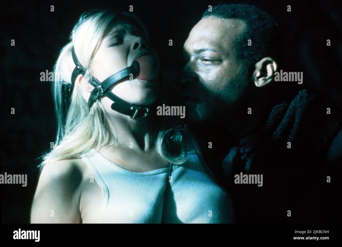 Donna D'Errico & Tony Todd Film: Candyman: Day Of The Dead (USA 1999) Characters: Caroline McKeever, The Candyman  Director: Turi Meyer 09 July 1999   **WARNING** This Photograph is for editorial use only and is the copyright of ARTISAN and/or the Photographer assigned by the Film or Production Company and can only be reproduced by publications in conjunction with the promotion of the above Film. A Mandatory Credit To ARTISAN is required. The Photographer should also be credited when known. No commercial use can be granted without written authority from the Film Company. Stock Photo