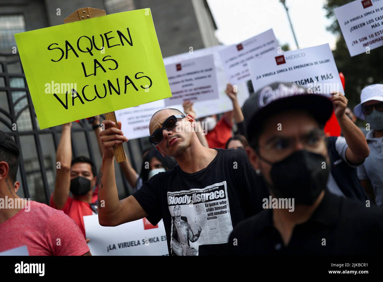 An activist holds a sign reading 'Release the vaccines' during a protest to call for a stronger response by the government to the monkeypox crisis, outside the Health Secretary building, in Mexico City, Mexico, Mexico, July 26, 2022. REUTERS/Edgard Garrido Stock Photo