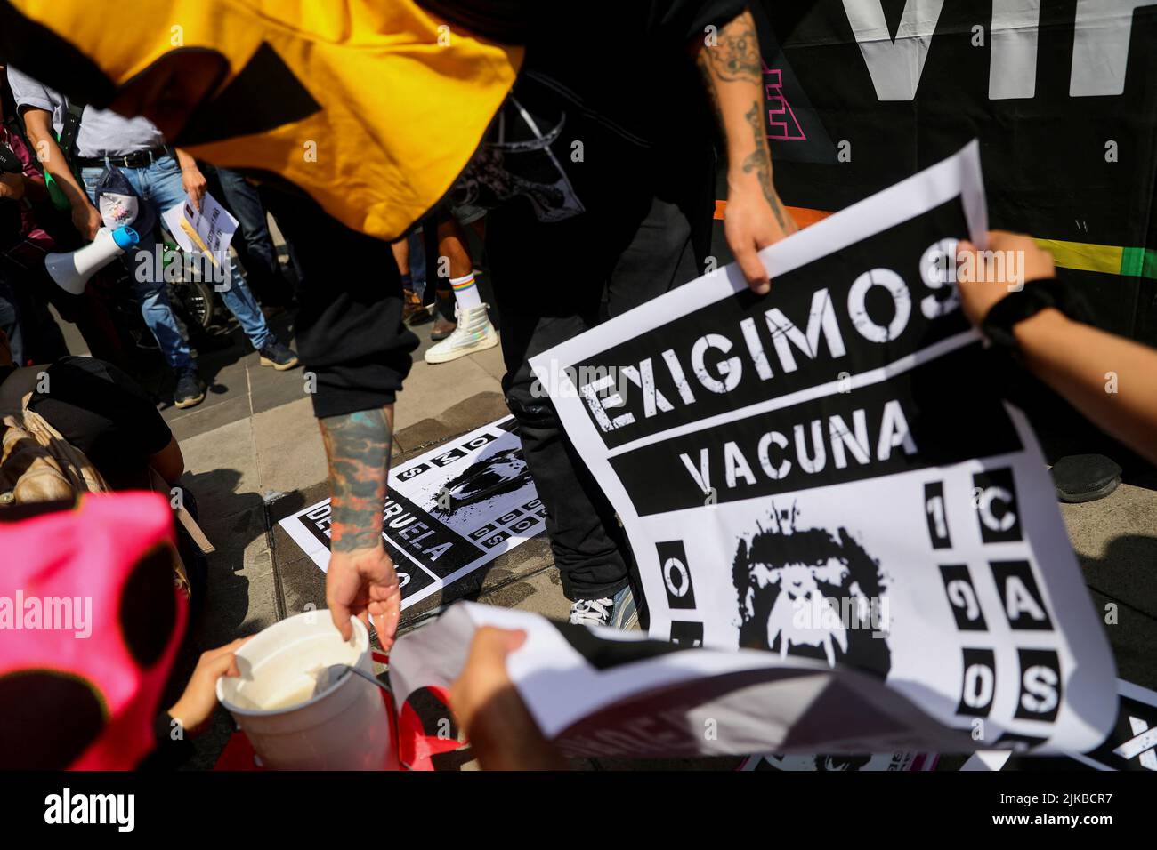 Activists hold posters during a protest to call for a stronger response by the government to the monkeypox crisis, outside the Health Secretary building, in Mexico City, Mexico, Mexico, July 26, 2022. REUTERS/Edgard Garrido Stock Photo