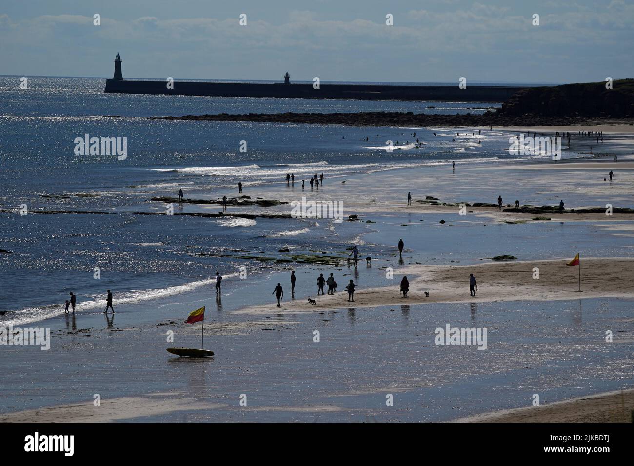 People enjoying the good weather at Tynemouth beach on the North East coast as the temperature hit 22 degrees. Picture date: Monday August 1, 2022. See PA story WEATHER Summer. Photo credit should read: Owen Humphreys/PA Wire Stock Photo