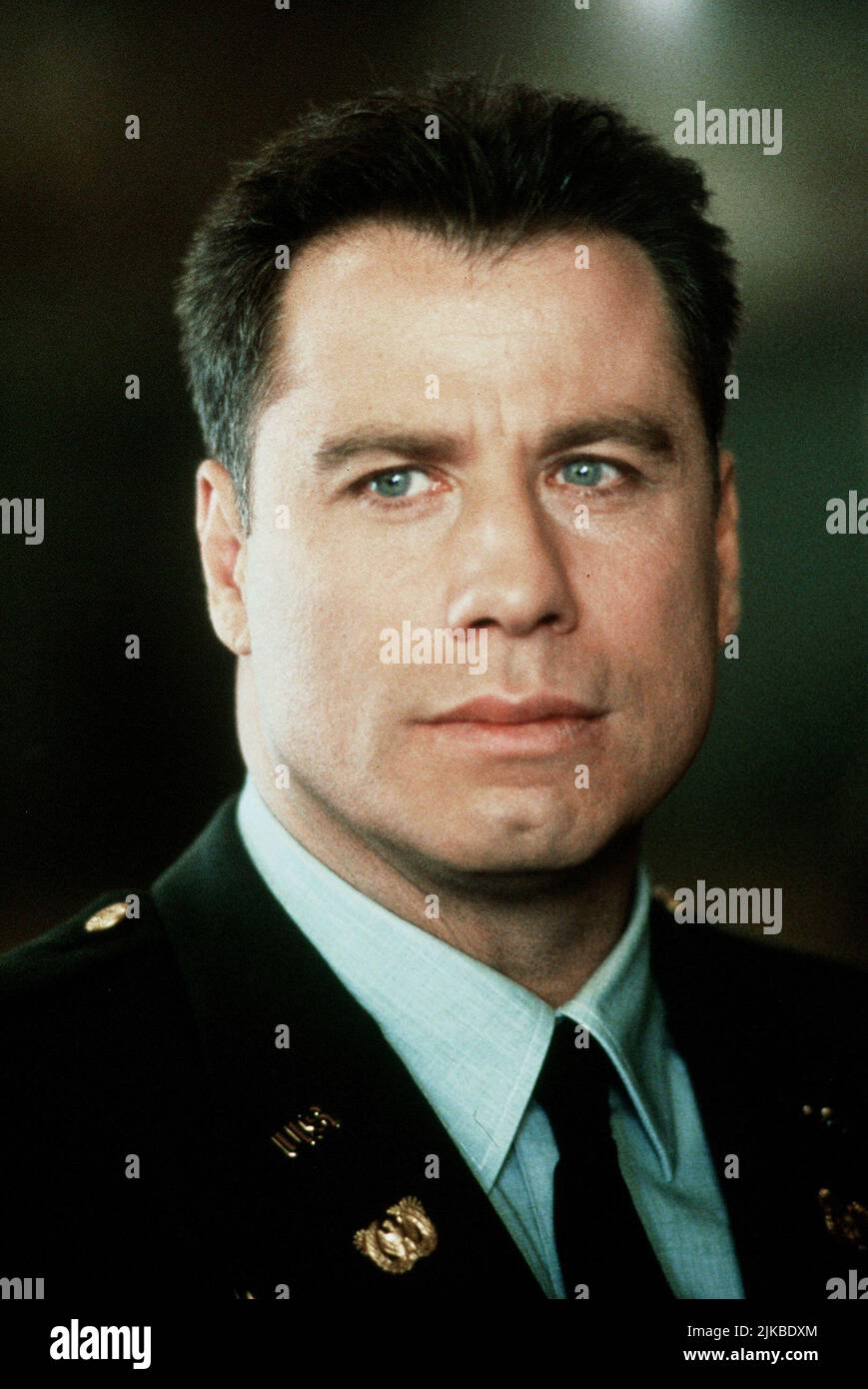 John Travolta Film: The General'S Daughter (1999) Characters: Warr. Off. Paul Brenner  Director: Simon West 18 June 1999   **WARNING** This Photograph is for editorial use only and is the copyright of PARAMOUNT PICTURES and/or the Photographer assigned by the Film or Production Company and can only be reproduced by publications in conjunction with the promotion of the above Film. A Mandatory Credit To PARAMOUNT PICTURES is required. The Photographer should also be credited when known. No commercial use can be granted without written authority from the Film Company. Stock Photo