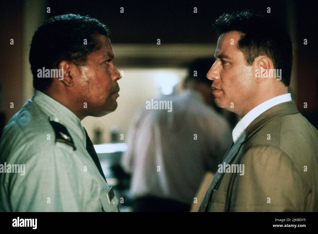Clarence Williams Iii & John Travolta Film: The General'S Daughter (1999) Characters: Col. George Fowler & Warr. Off. Paul Brenner  Director: Simon West 18 June 1999   **WARNING** This Photograph is for editorial use only and is the copyright of PARAMOUNT PICTURES and/or the Photographer assigned by the Film or Production Company and can only be reproduced by publications in conjunction with the promotion of the above Film. A Mandatory Credit To PARAMOUNT PICTURES is required. The Photographer should also be credited when known. No commercial use can be granted without written authority from t Stock Photo
