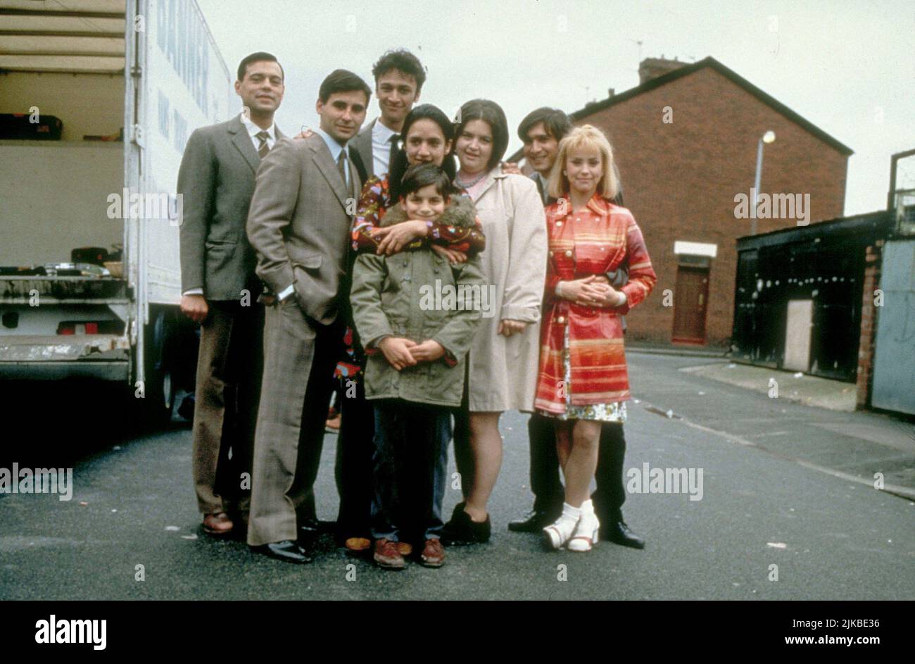 Emil Marwa, Raji James, Chris Bisson, Archie Panjabi, Jordan Routledge, Ruth Jones, Jimi Mistry & Emma Rydal Film: East Is East (UK 1999) Characters: Maneer Khan,Abdul Khan,Saleem Khan,Meenah Khan,Sajid Khan,Peggy,Tariq Khan & Stella Moorhouse  Director: Damien O'Donnell 14 May 1999   **WARNING** This Photograph is for editorial use only and is the copyright of FILMFOUR and/or the Photographer assigned by the Film or Production Company and can only be reproduced by publications in conjunction with the promotion of the above Film. A Mandatory Credit To FILMFOUR is required. The Photographer sho Stock Photo