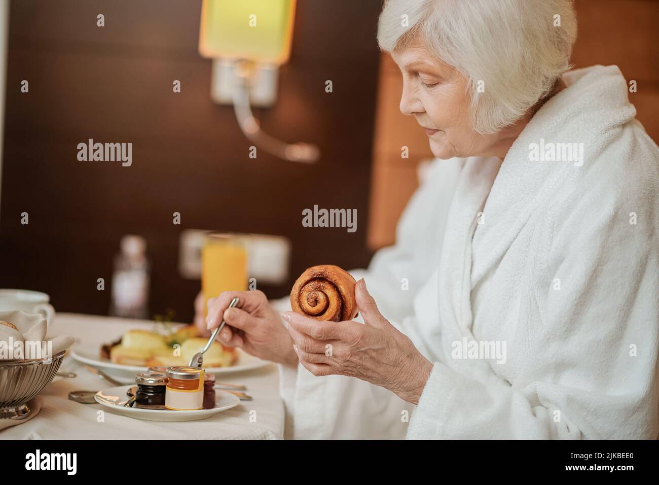 Breakfast In Robe Mature woman in white robe hi-res stock photography and images - Alamy