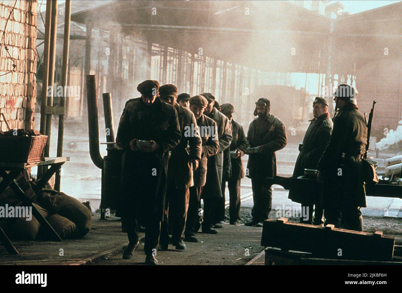 Jews Queue For Food Film: Jakob The Liar (1999)   Director: Peter Kassovitz 16 September 1999   **WARNING** This Photograph is for editorial use only and is the copyright of TRISTAR PICTURES / EGON ENDRÉNYI and/or the Photographer assigned by the Film or Production Company and can only be reproduced by publications in conjunction with the promotion of the above Film. A Mandatory Credit To TRISTAR PICTURES / EGON ENDRÉNYI is required. No commercial use can be granted without written authority from the Film Company. Stock Photo