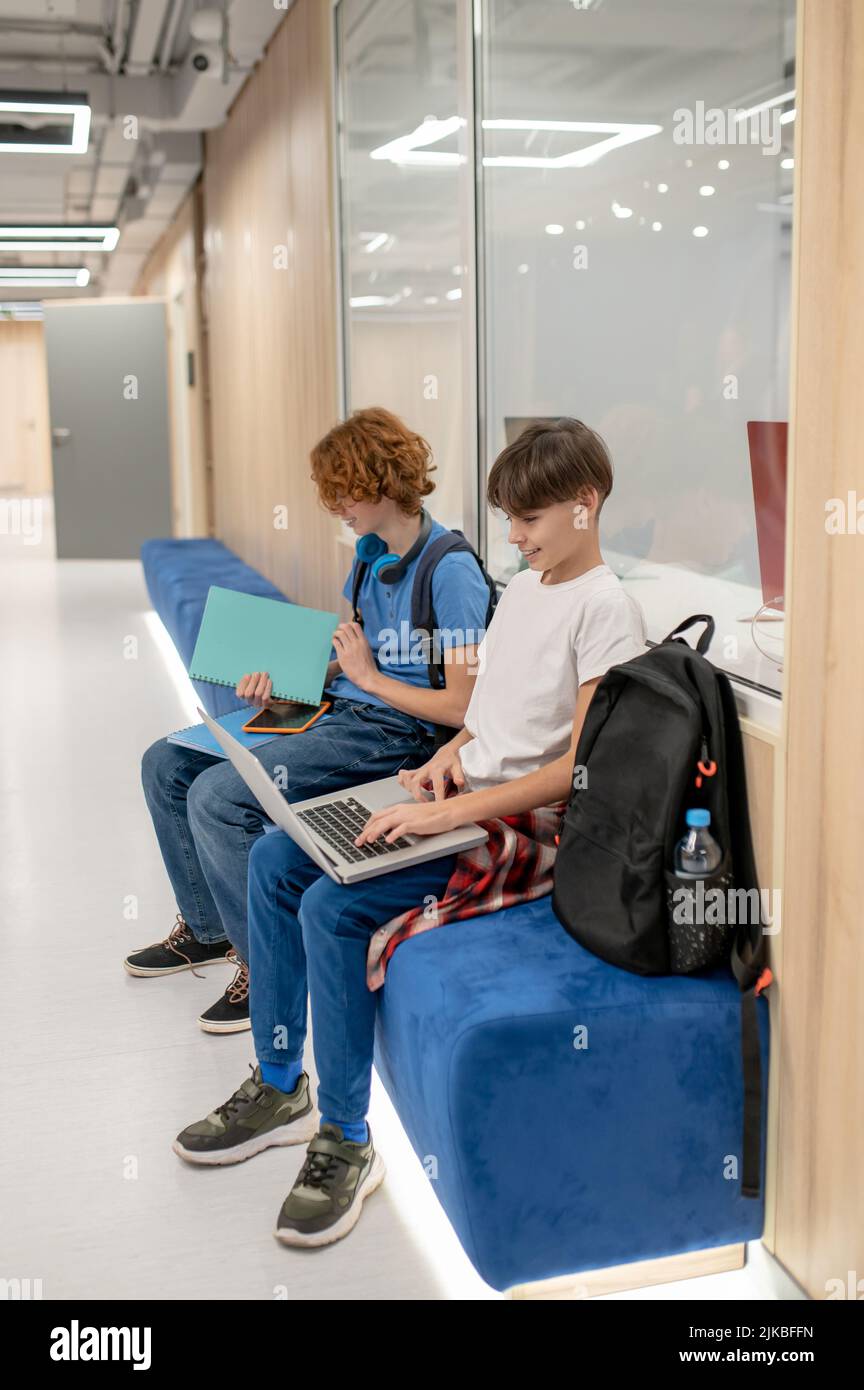 Two school friends getting ready for the lesson Stock Photo