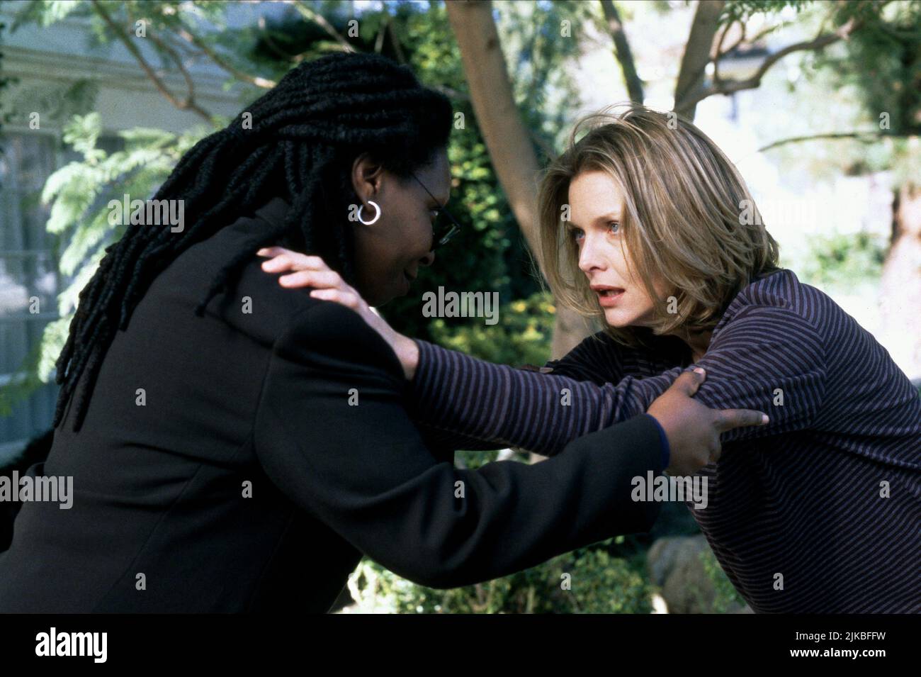 Whoopi Goldberg & Michelle Pfeiffer  Film The Deep End Of The Ocean (1999) Characters: Candy Bliss, Beth Cappadora  Director: Ulu Grosbard 12 March 1999   **WARNING** This Photograph is for editorial use only and is the copyright of COLUMBIA and/or the Photographer assigned by the  Film or Production Company and can only be reproduced by publications in conjunction with the promotion of the above  Film. A Mandatory Credit To COLUMBIA is required. The Photographer should also be credited when known. No commercial use can be granted without written authority from the  Film Company. Stock Photo