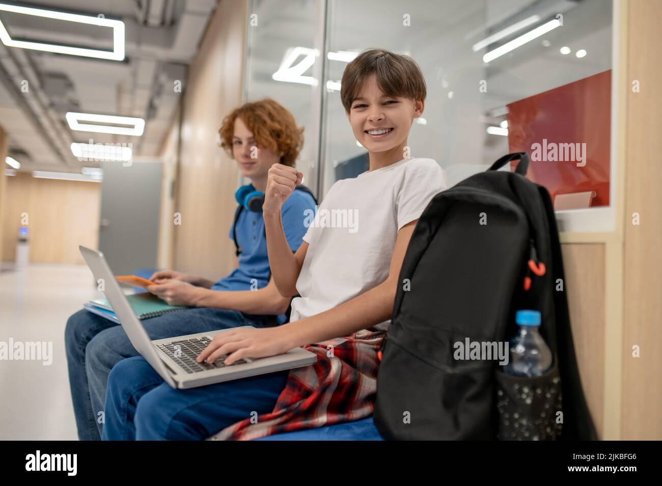 Two school friends getting ready for the lesson Stock Photo