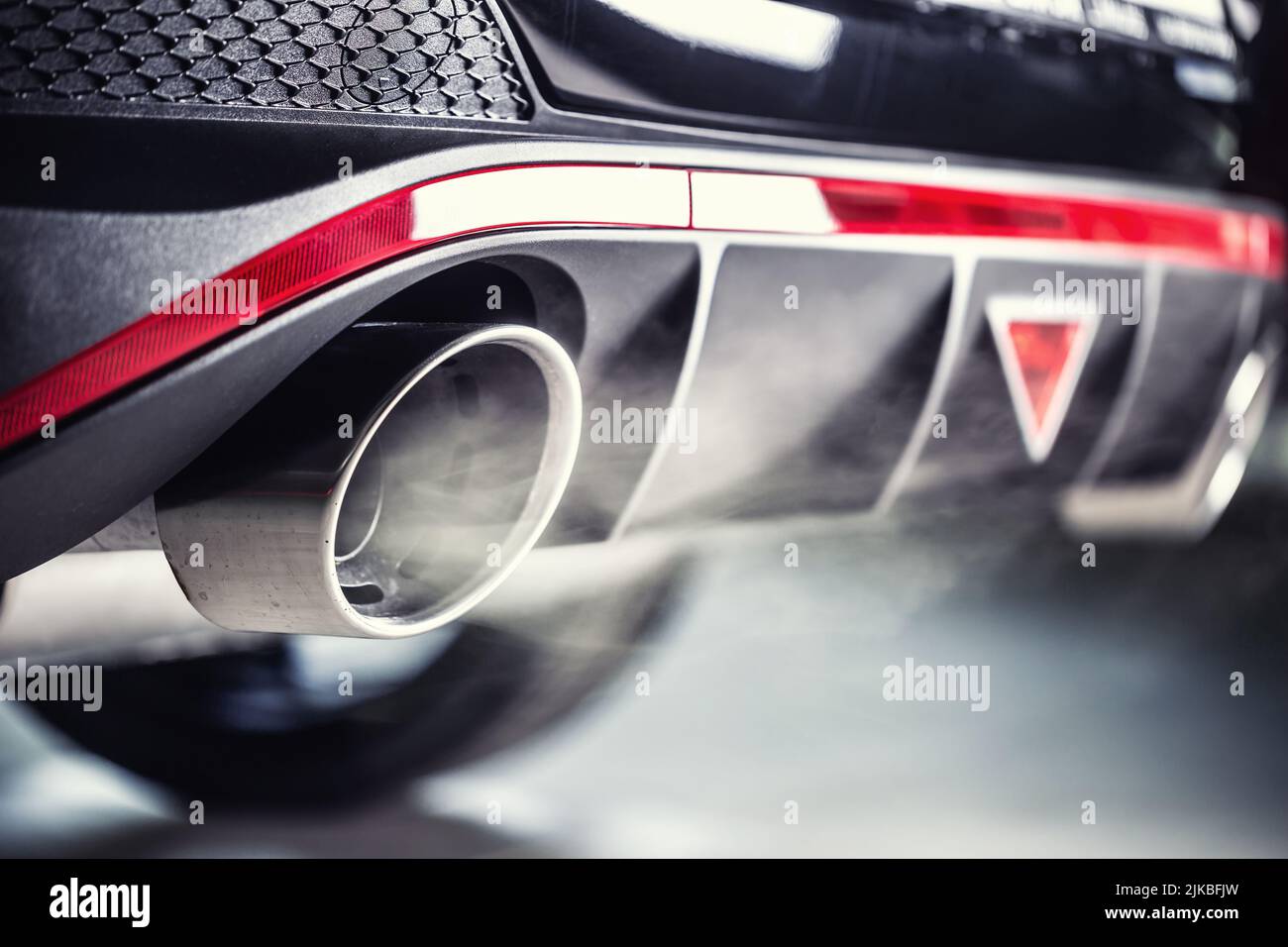 Leaking gases from the exhaust of a petrol or diesel car Stock Photo