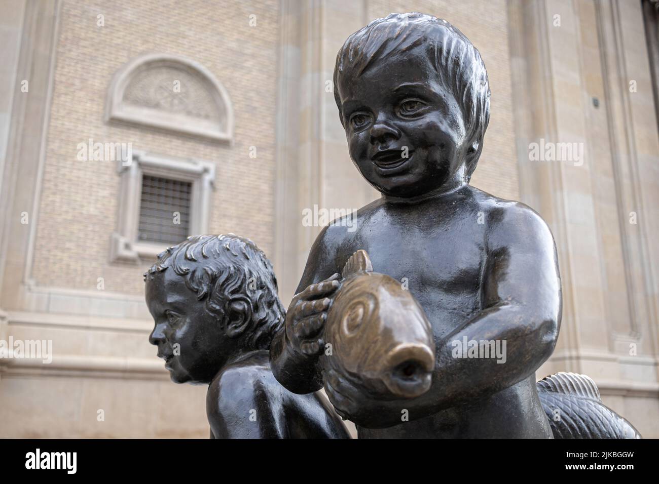 ZARAGOZA, SPAIN-MAY 15, 2021: Bronze statue of a boy with a fish - fontain on Plaza del Pillar Stock Photo