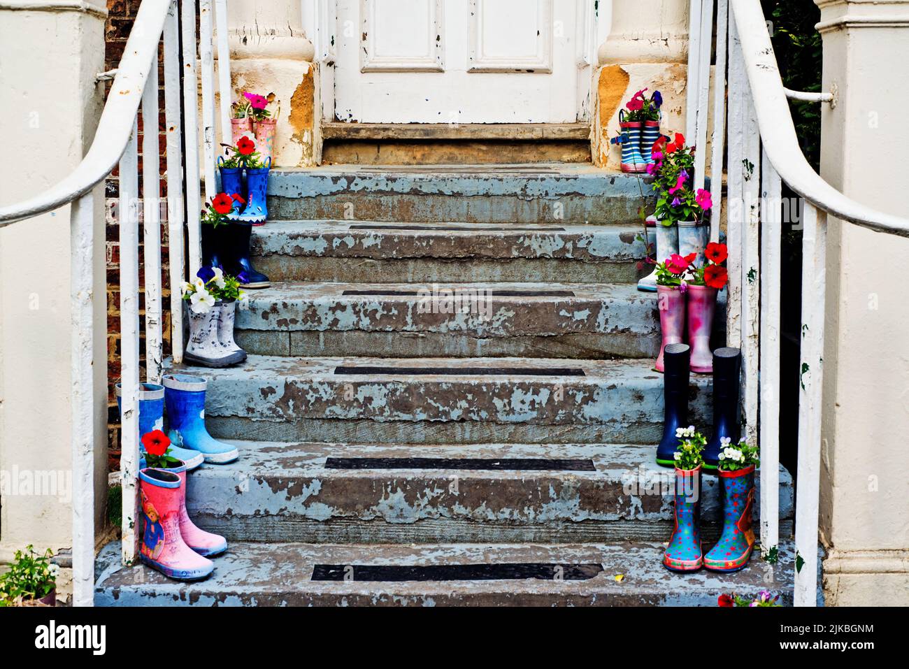 Ornamental boots on Steps, High Street, Yarm on Tees, East Riding Yorkshire, England Stock Photo