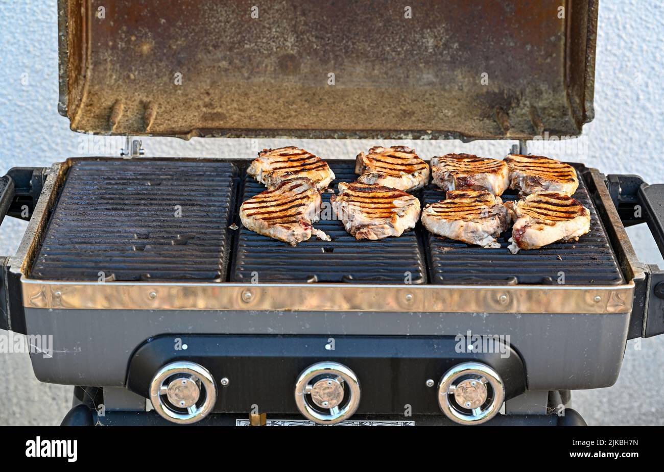 pork chop on grill an evening in july Stock Photo