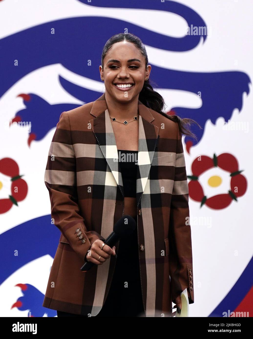 Presenter Alex Scott on stage during a fan celebration to commemorate England's historic UEFA Women's EURO 2022 triumph in Trafalgar Square, London. Picture date: Monday August 1, 2022. Stock Photo
