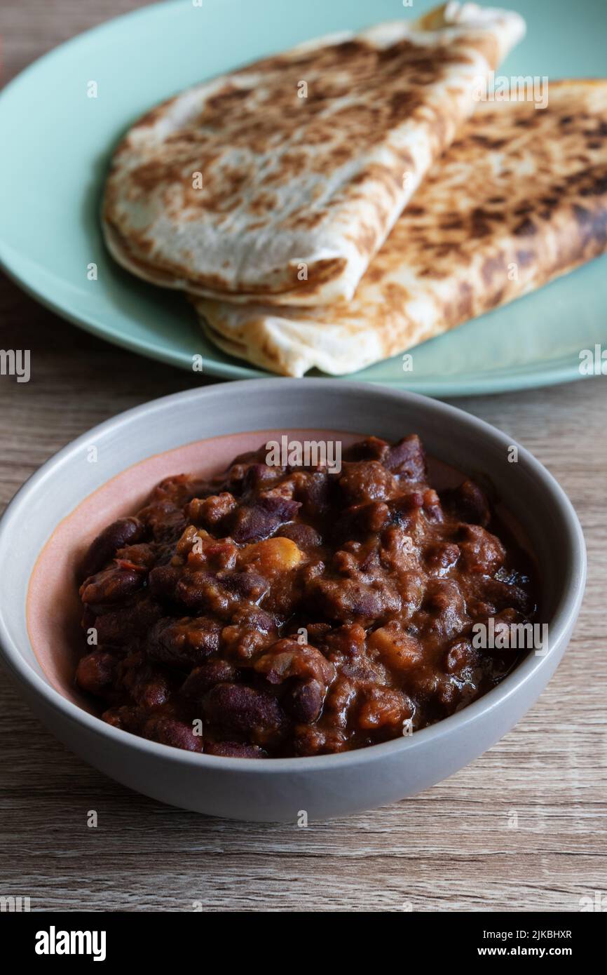 Chili con carne in a bowl with quesadillas Stock Photo Alamy