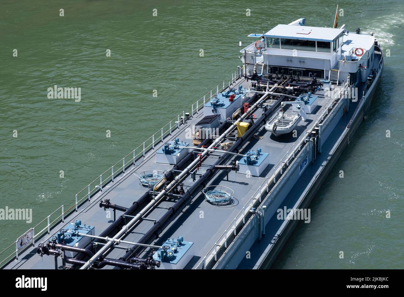 Barge seen from above with pipelines on the deck for industrial