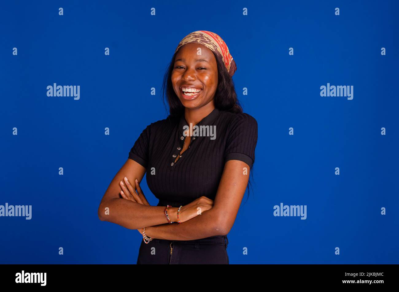 Portrait of a happy young african american black woman celebrating ...