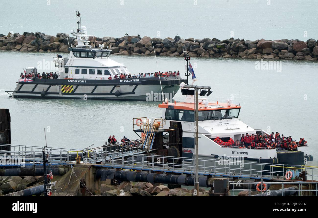 Groups of people thought to be migrants are brought in to Ramsgate, Kent, onboard Border Force vessels following a number of small boat incidents in the Channel. Picture date: Monday August 1, 2022. Stock Photo