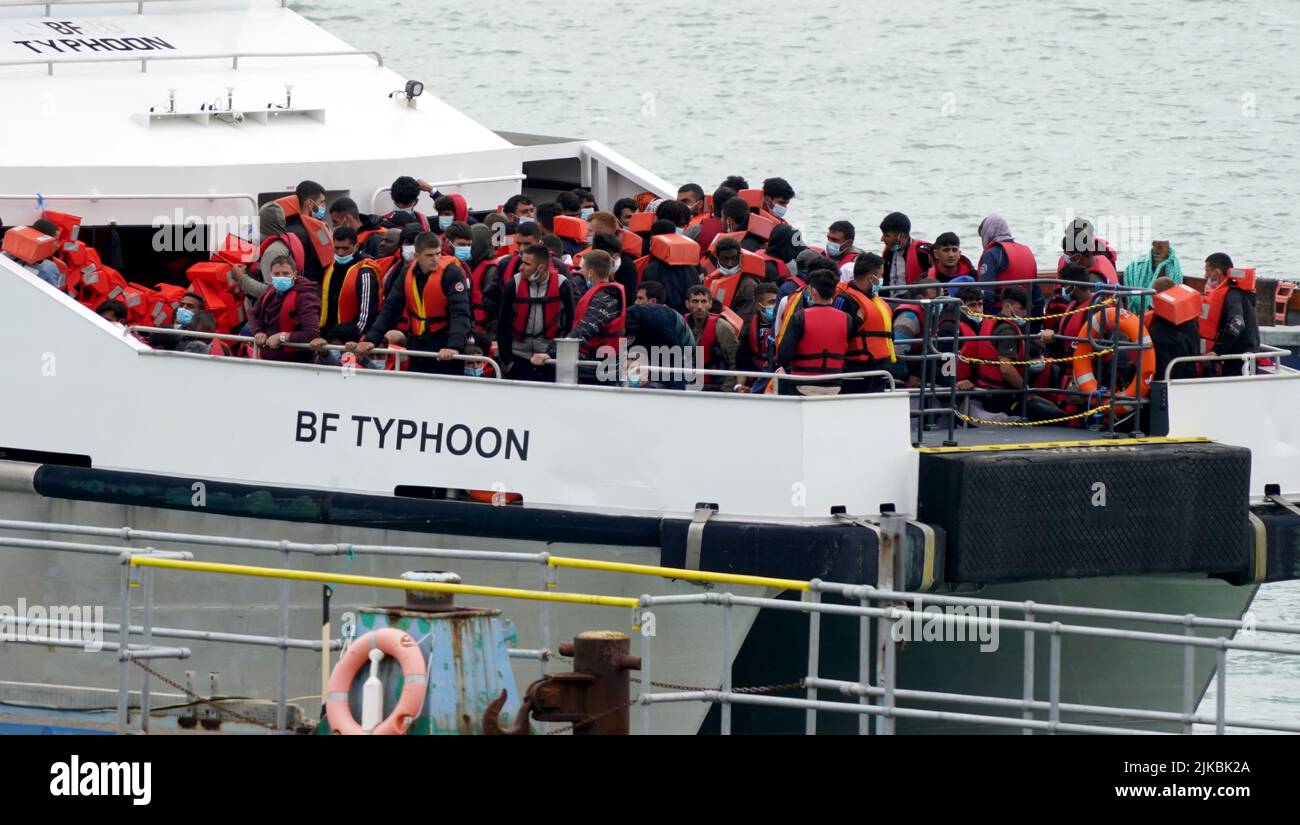 A group of people thought to be migrants are brought in to Ramsgate, Kent, onboard a Border Force vessel following a small boat incident in the Channel. Picture date: Monday August 1, 2022. Stock Photo