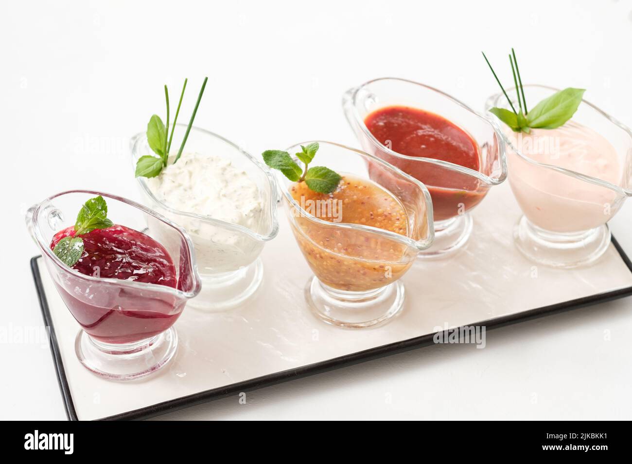 homemade sauce assorted glass gravy boat platter Stock Photo