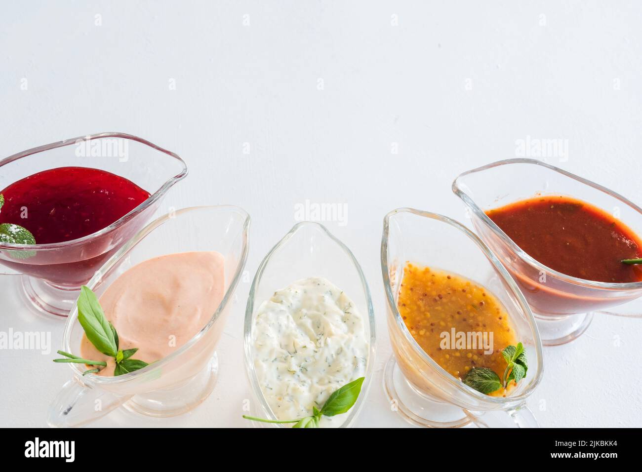spicy cooking assorted sauce glass gravy boats Stock Photo Alamy