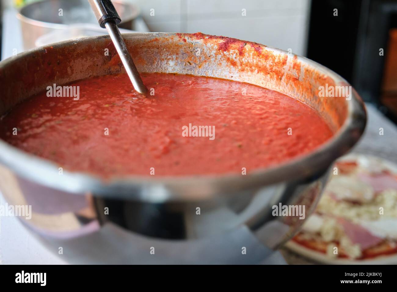 classic-homemade-italian-tomato-sauce-with-basil-for-pizza-stock-photo
