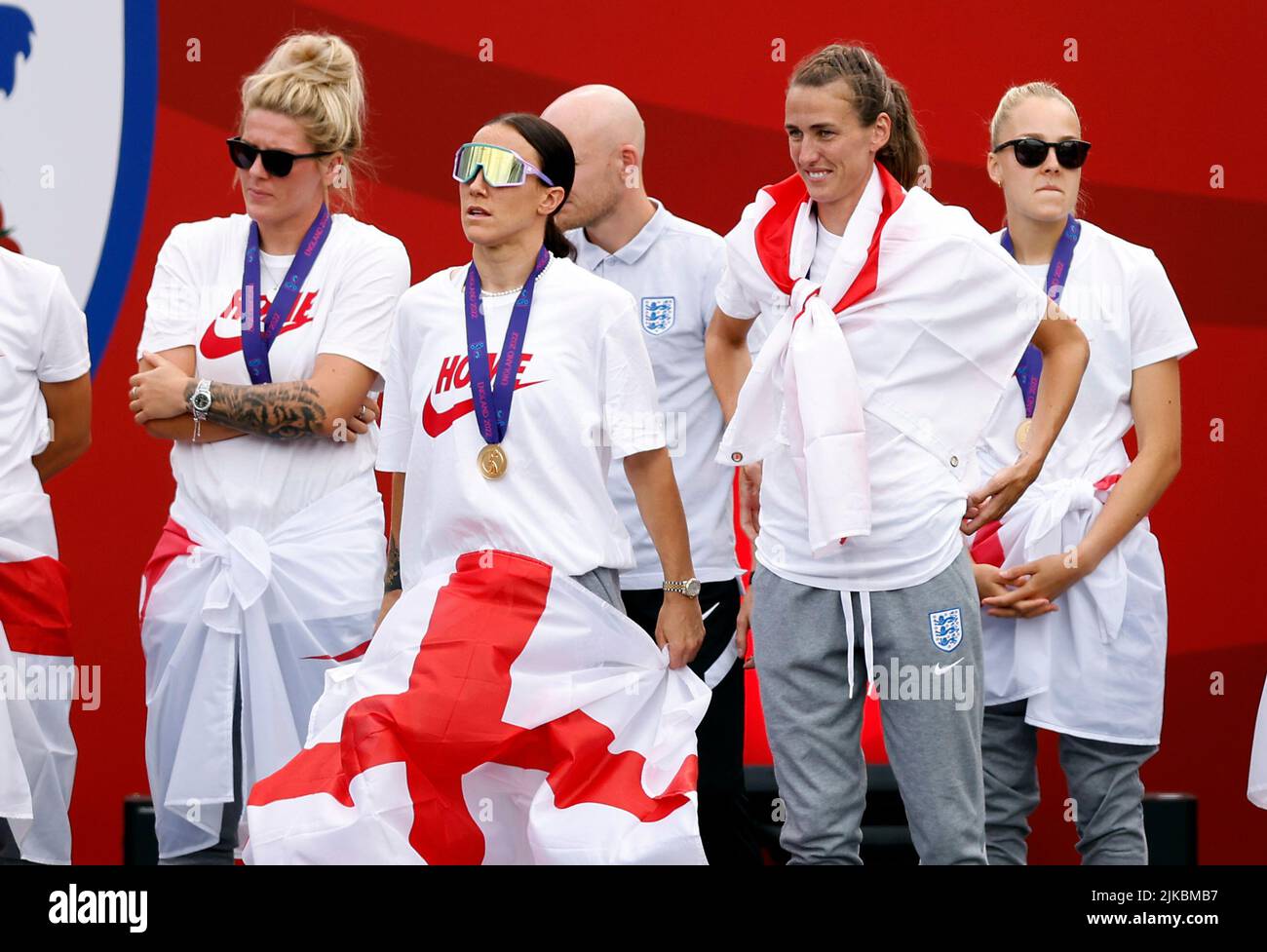 England’s Millie Bright, Lucy Bronze and Jill Scott on stage during a fan celebration to commemorate England's historic UEFA Women's EURO 2022 triumph in Trafalgar Square, London. Picture date: Monday August 1, 2022. Stock Photo