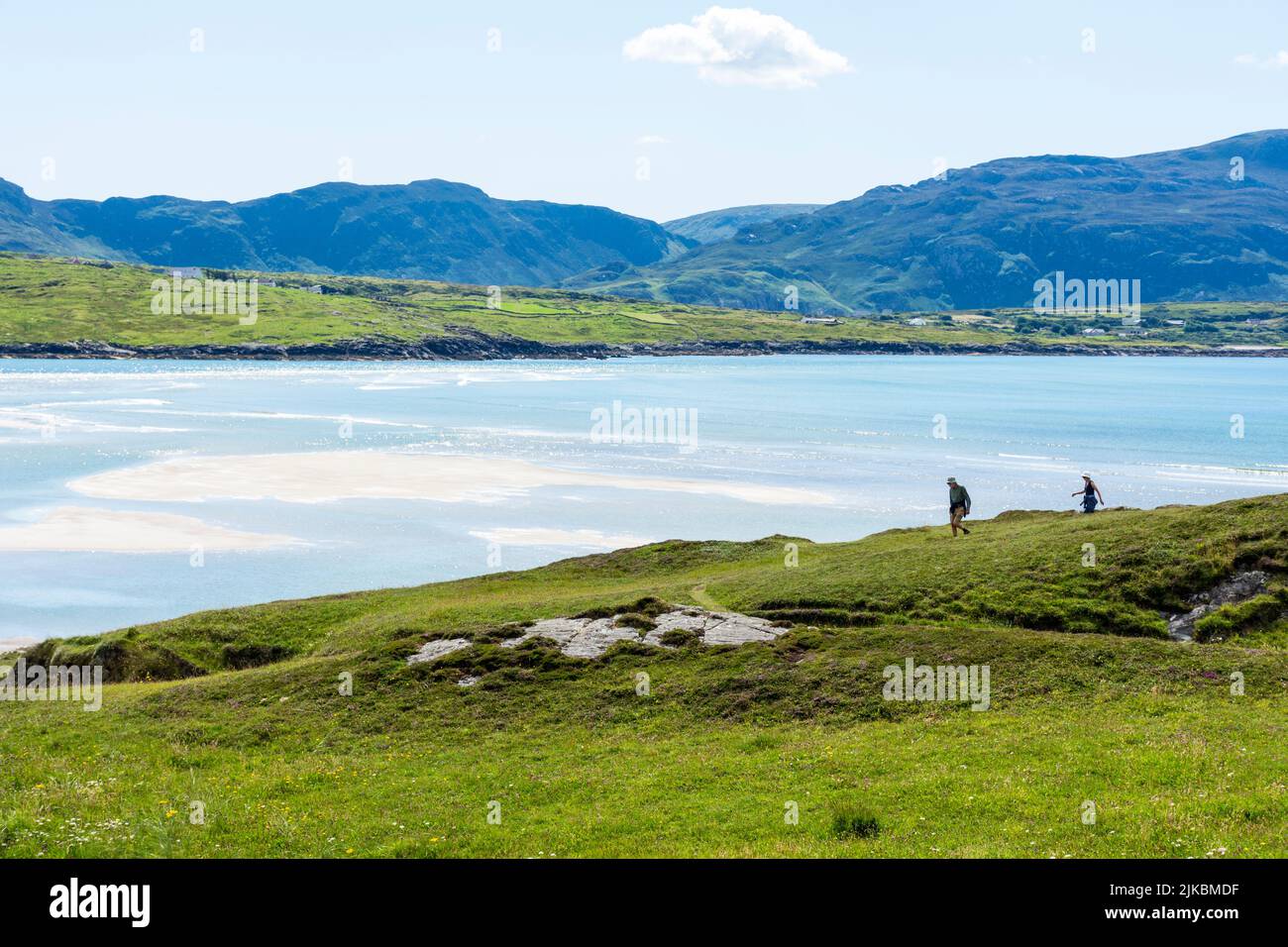 Walkers on  Sheskinmore Nature Reserve. Sheskinmore refers to a large area of sand dunes, lake and marsh that lies between Kiltooris and Ballinreavy S Stock Photo