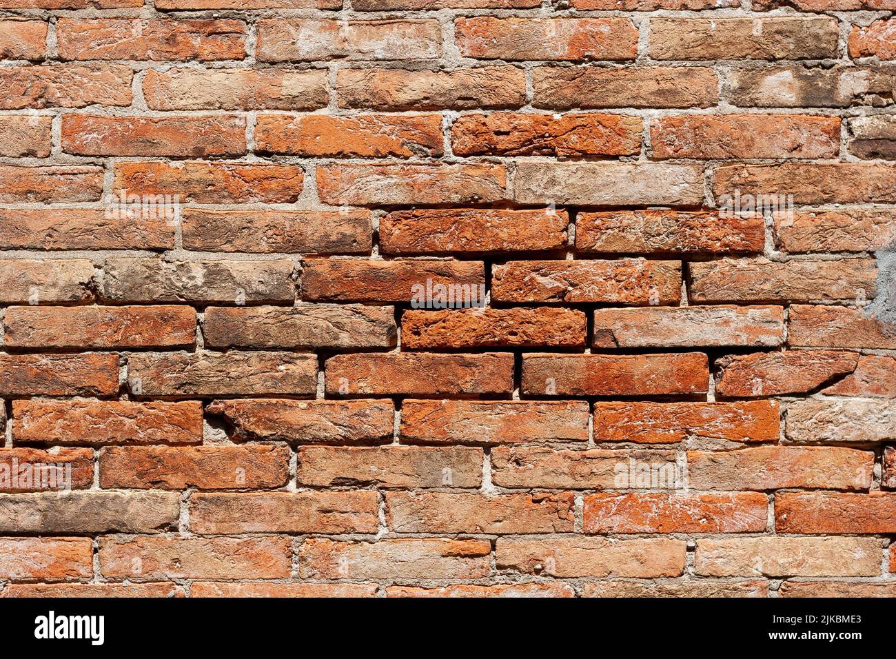 Weathered red brick wall Stock Photo