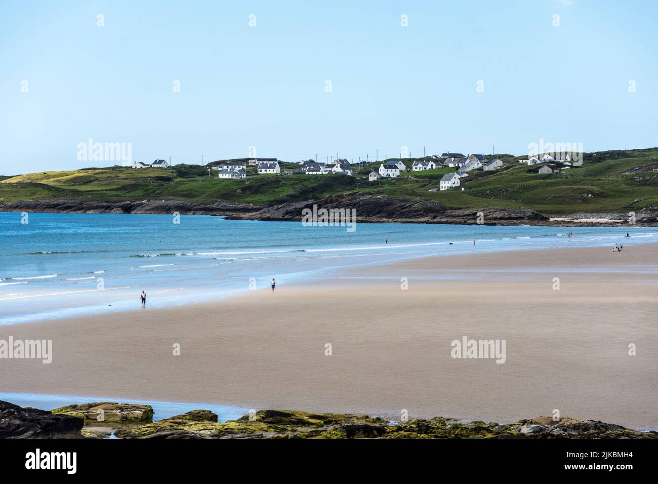 People on Trawmore strand beach near Rosbeg, County Donegal, Ireland