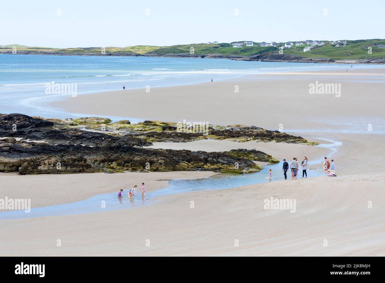 People on Trawmore strand beach near Rosbeg, County Donegal, Ireland. On the Wild Atlantic Way coast of the ocean Stock Photo