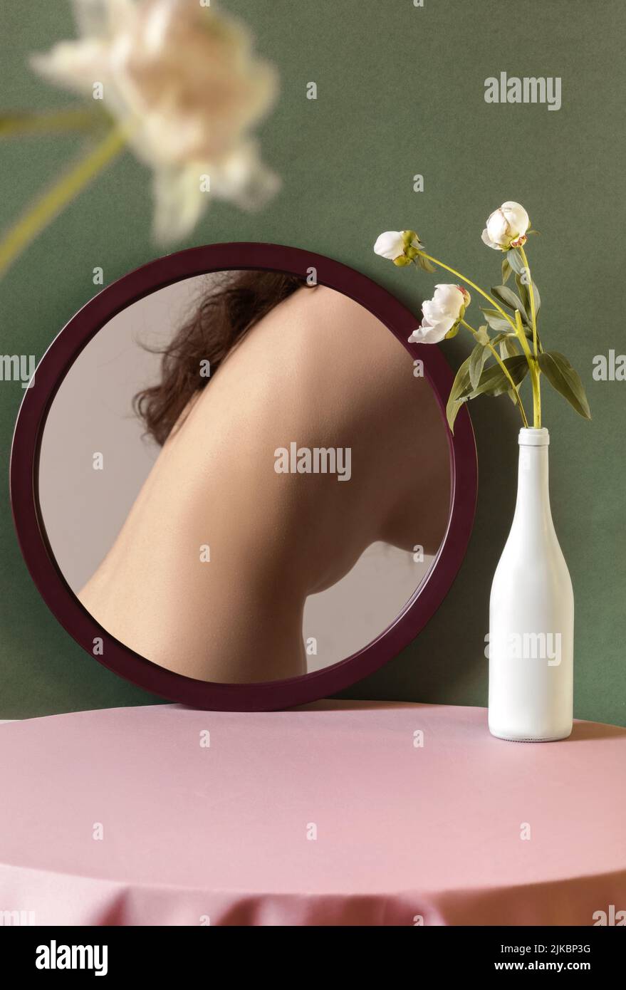 Tender female body, back on mirror reflection. Home interior background ...