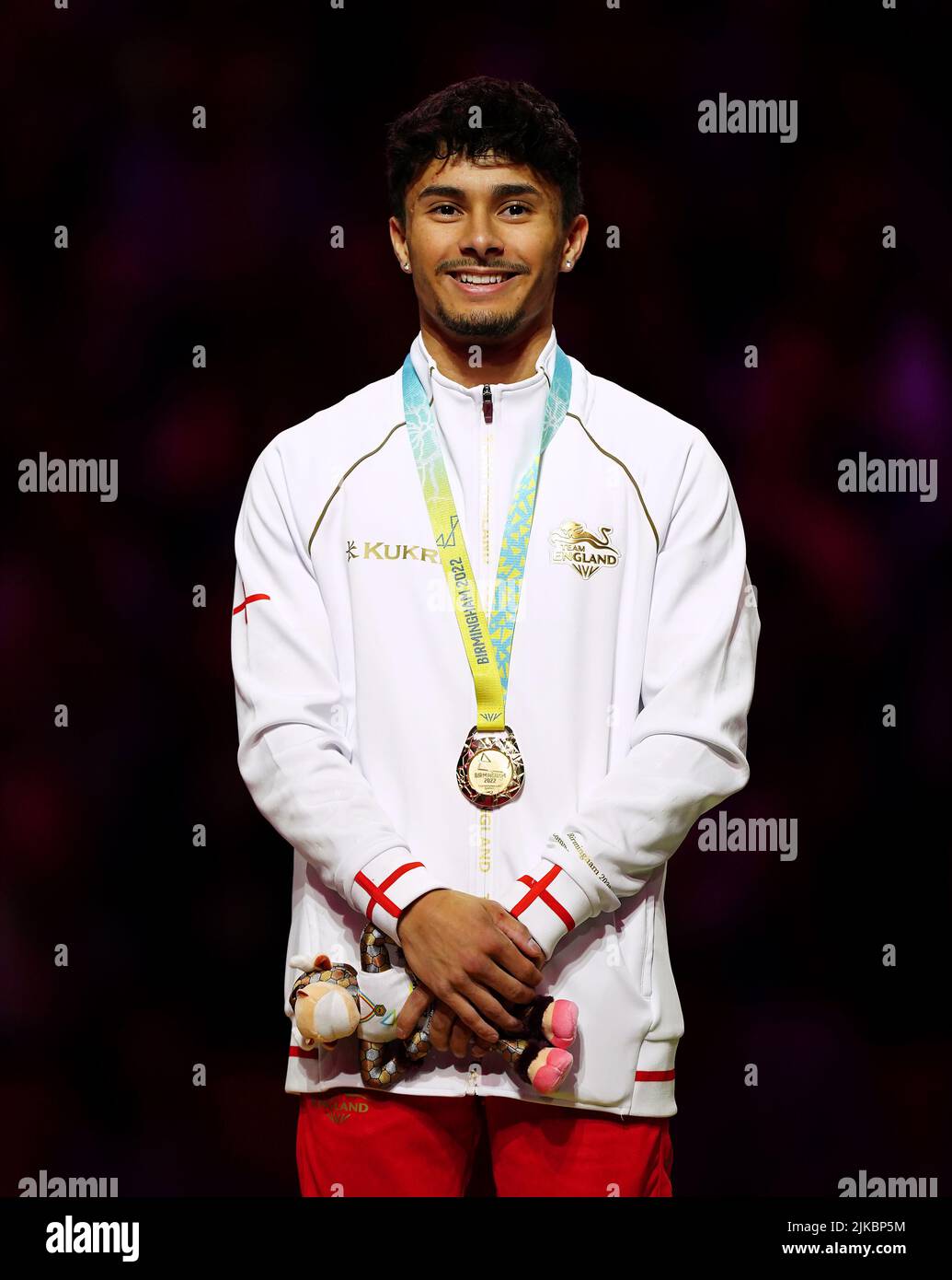 England’s Jake Jarman receives his gold medal for the Men's Floor Exercise Final at Arena