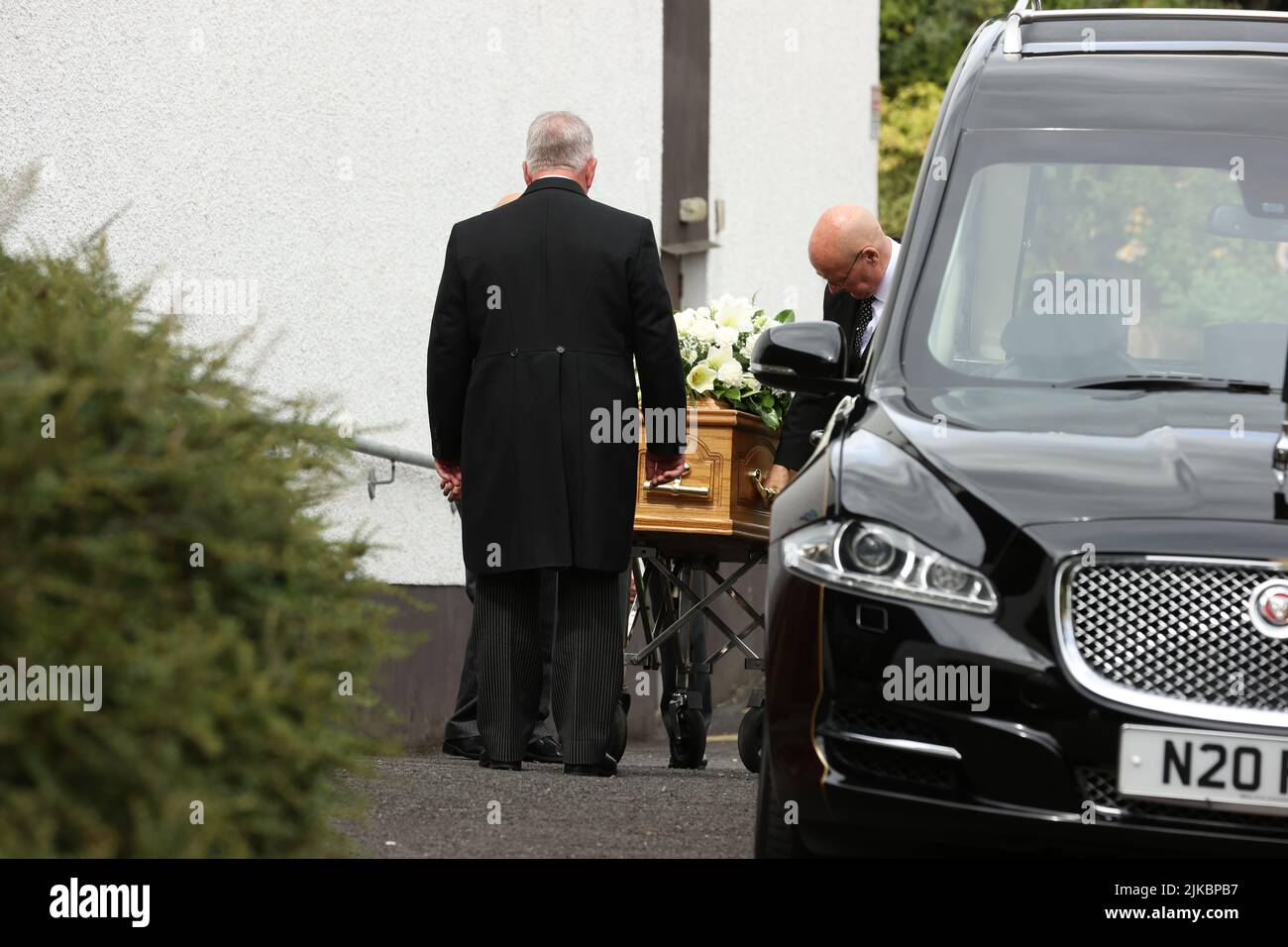 Pallbearers carry the coffin of Northern Ireland first minister and UUP