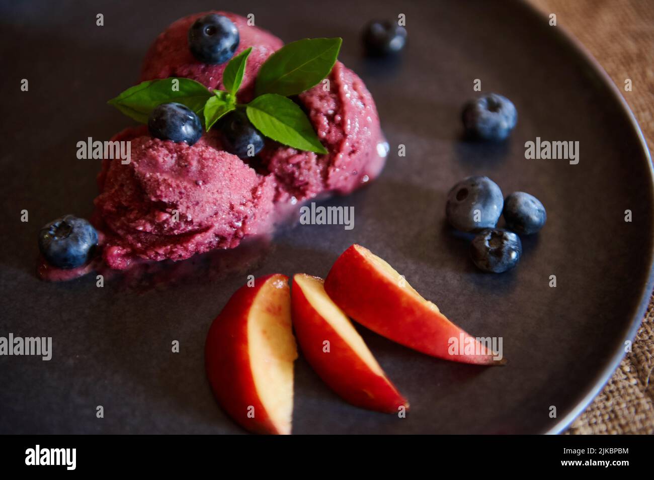 Healthy, raw vegan dessert. Homemade blueberry sorbet, ice cream with