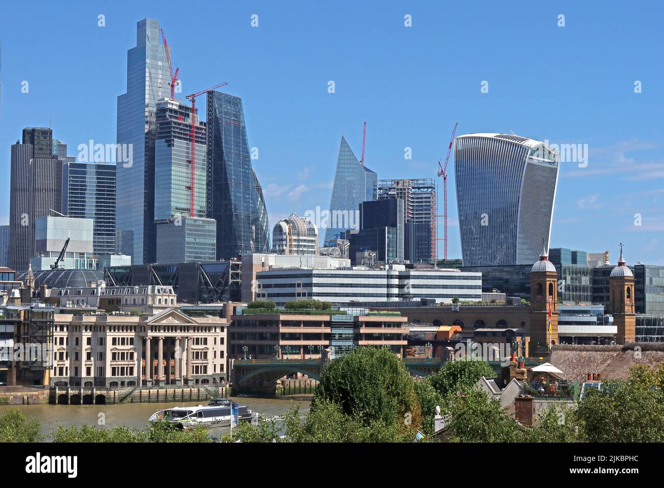 City of London skyline and financial buildings, from south of the river, the Walkie Talkie, Cheese Grater, behind the river Thames, London, England,UK Stock Photo
