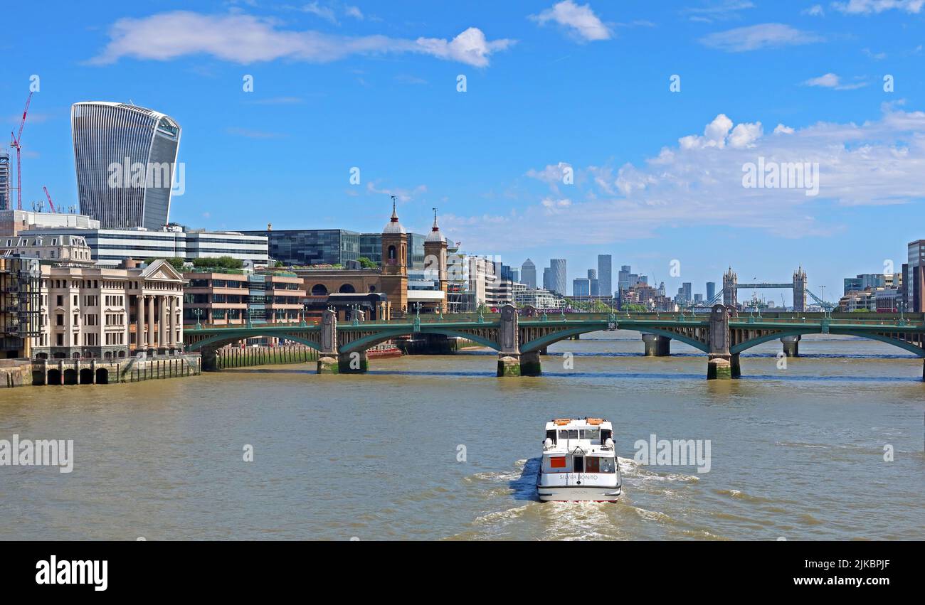 Silver Bonito boat ,sails east towards London Bridge and city of London, England, UK Stock Photo