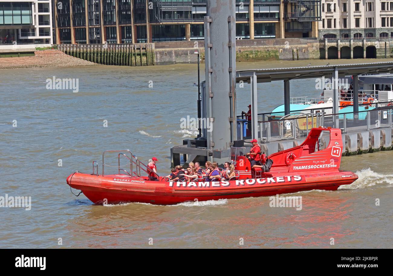 Rocket Junior speedboat - Red Thames rocket boat with tourists, at Bankside, Southwark,  London, England, UK, SE1 9DT Stock Photo