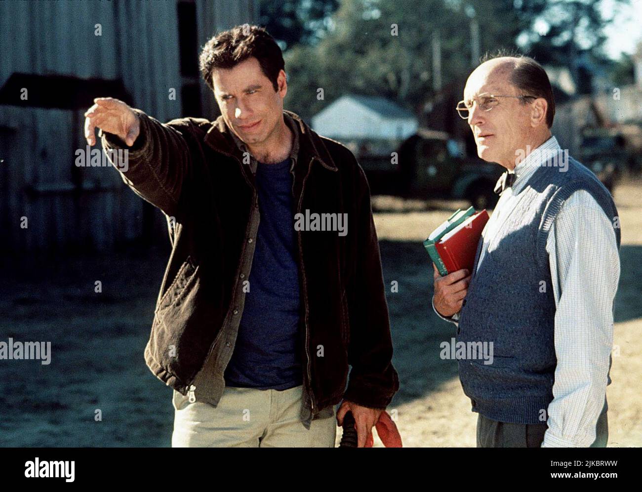John Travolta & Robert Duvall Film: Phenomenon (1998) Characters: George Malley & Doc Brunder  Director: Jon Turteltaub 03 July 1996   **WARNING** This Photograph is for editorial use only and is the copyright of TOUCHSTONE and/or the Photographer assigned by the Film or Production Company and can only be reproduced by publications in conjunction with the promotion of the above Film. A Mandatory Credit To TOUCHSTONE is required. The Photographer should also be credited when known. No commercial use can be granted without written authority from the Film Company. Stock Photo