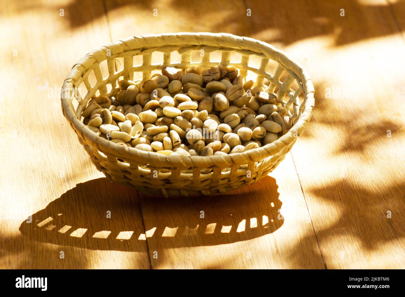 Green unroasted coffee beans in a basket Stock Photo - Alamy