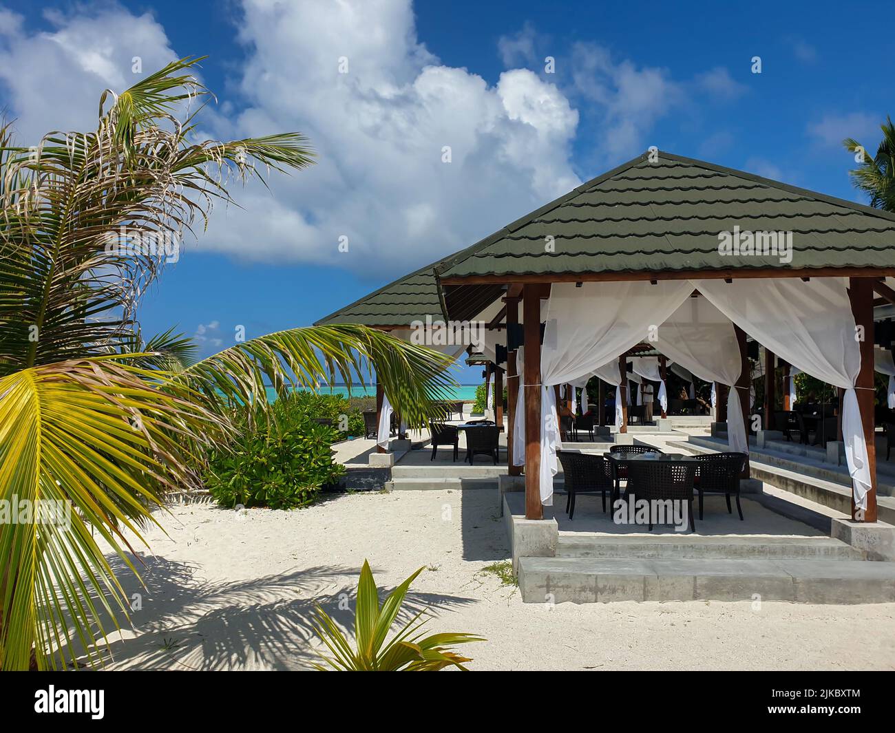 Overwater bungalows and luxury villas in the blue lagoon, on the white
