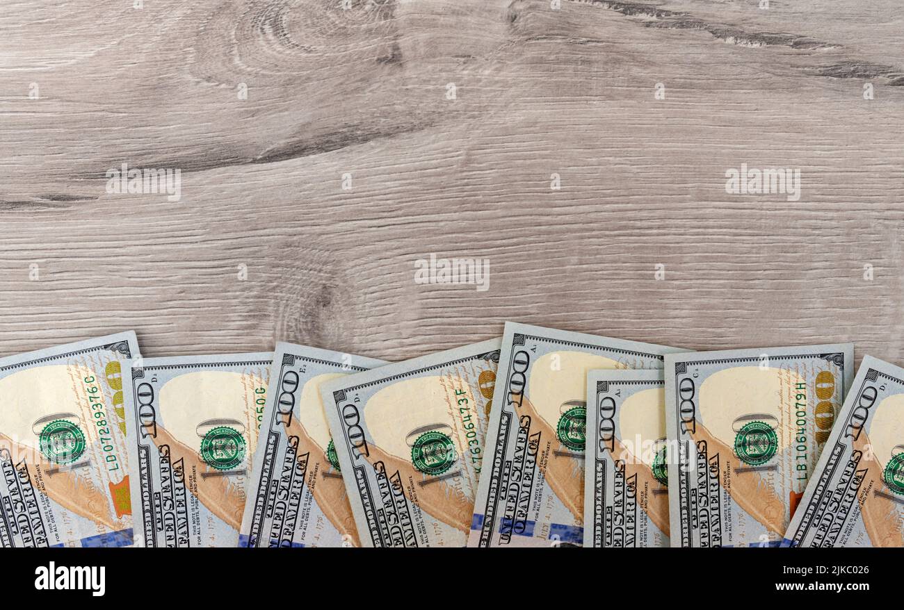 Dollars are beautifully laid out on a uniform background. Stock Photo