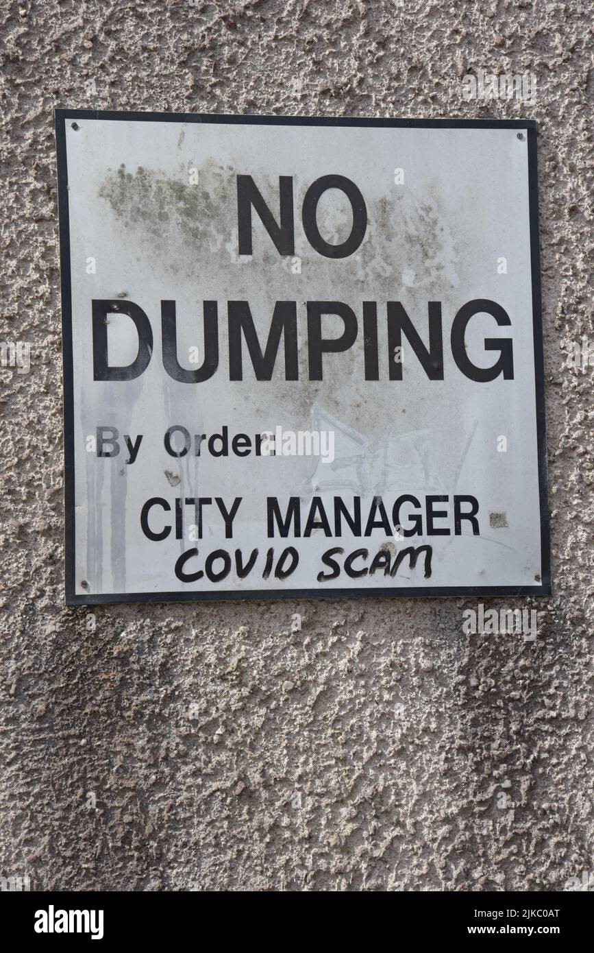 A Covid anti vaxxer hoax piece of graffiti sprayed onto a sign in Cork City, Ireland, JUly 2022 Stock Photo