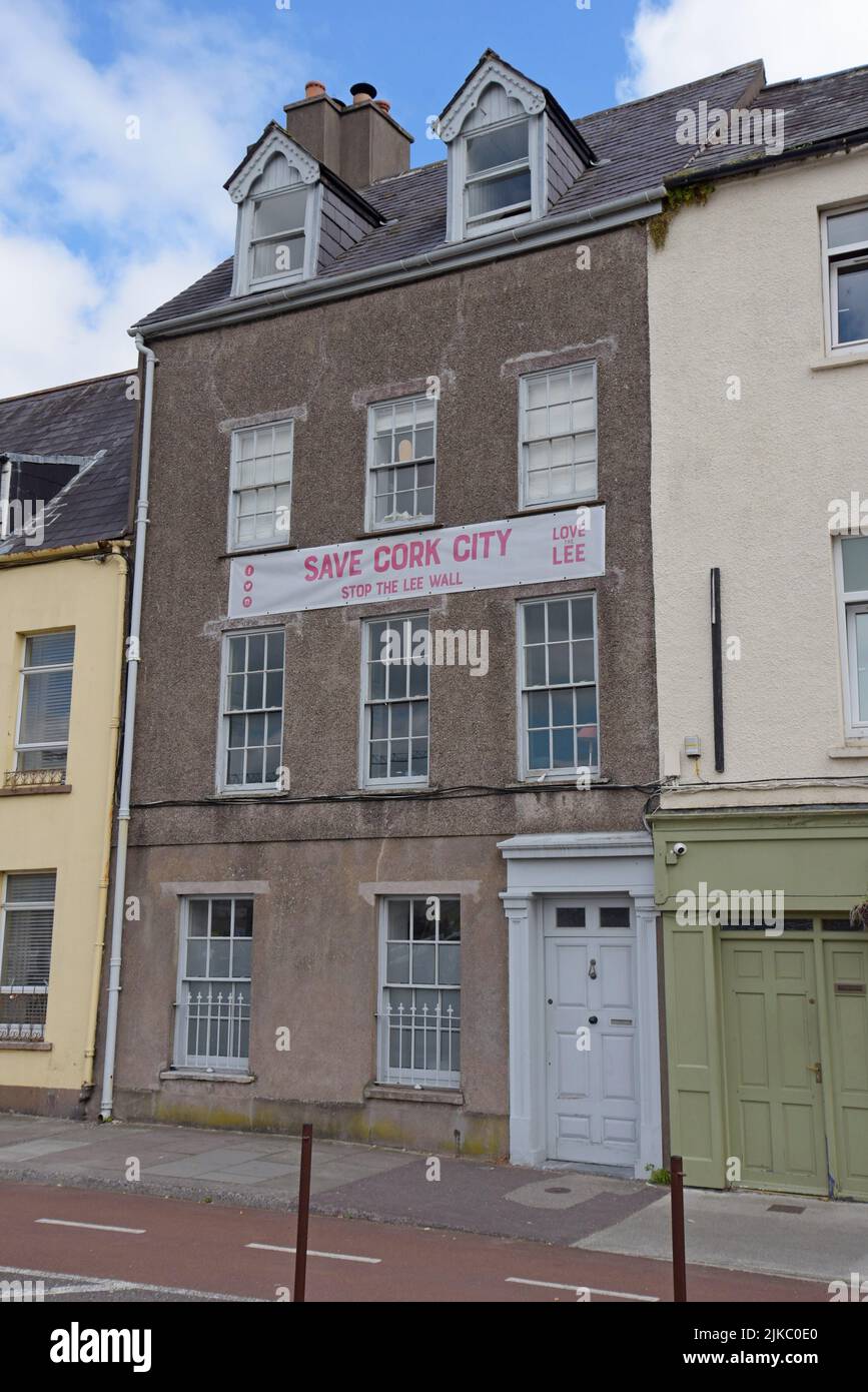 House on River Lee waterfront, Cork City, Ireland with a banner against proposed Flood Wall project for 15km of flood barriers along the river bank Stock Photo