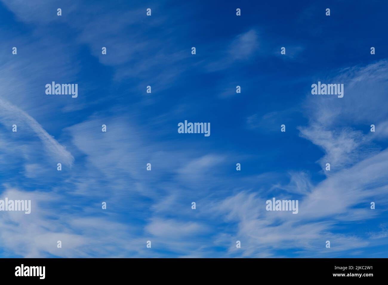 Deep blue skies with white clouds background with space for text, blue  cloudy skies texture, dark blue sky wallpaper with with white fully clouds  Stock Photo - Alamy