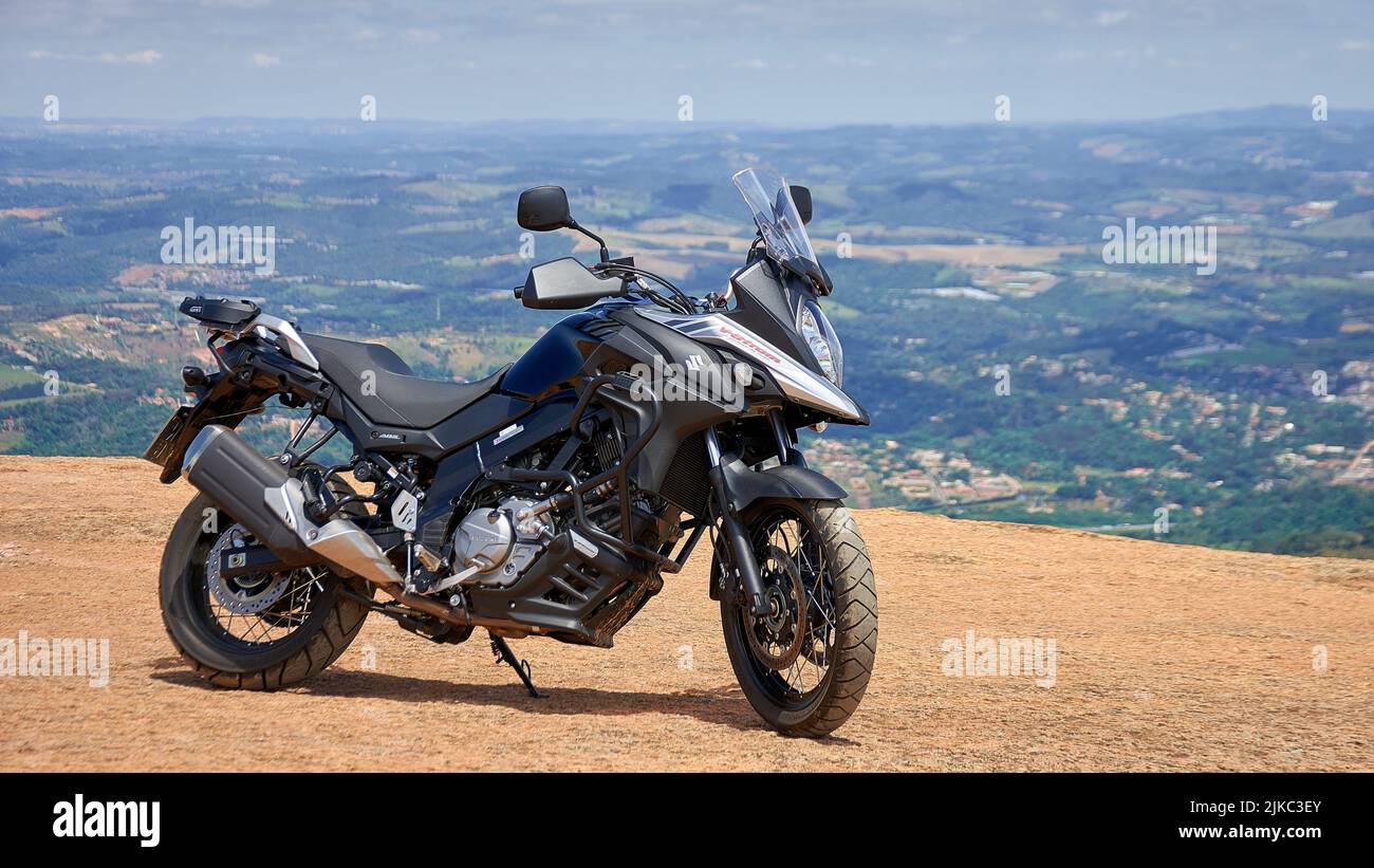 cruiser motorcycle on mountain with village background Stock Photo