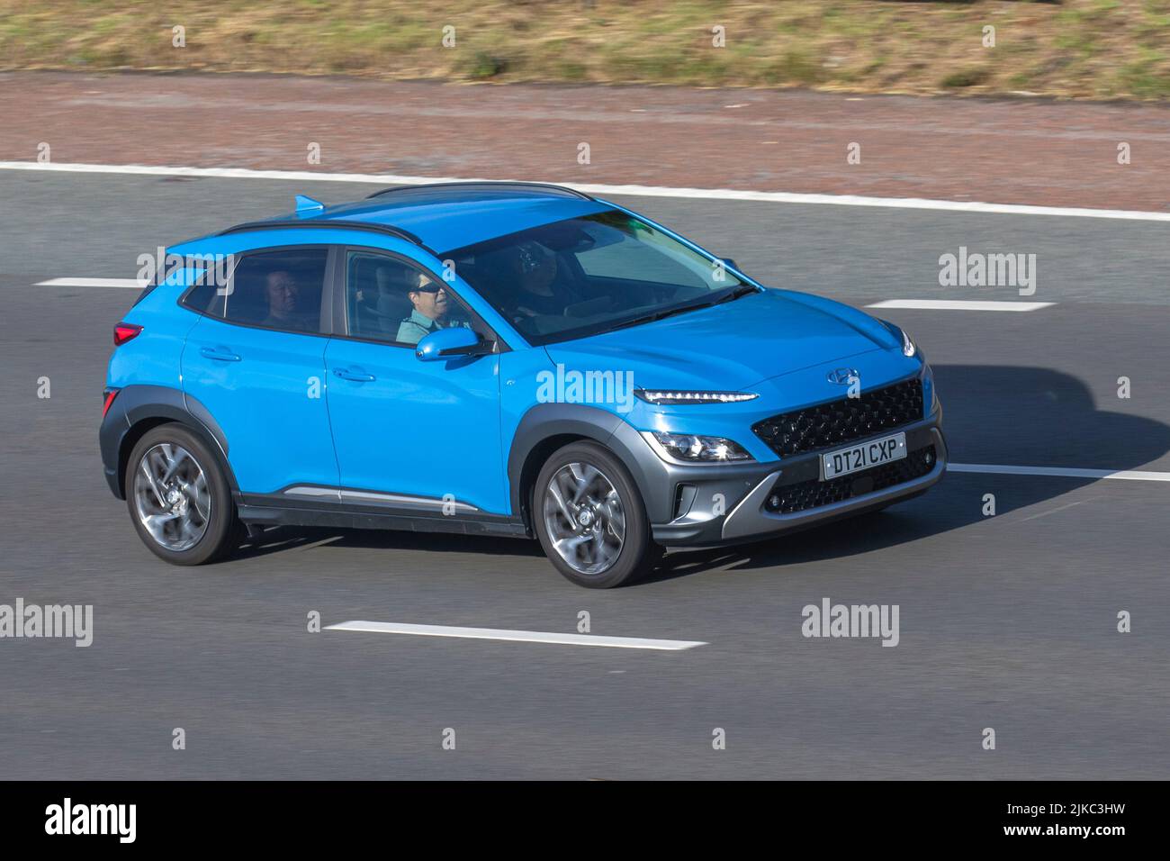 2021 blue HYUNDAI Hybrid Electric KONA Premium GDi Hev S-A 1580cc; moving, being driven, in motion, travelling on the M6 motorway, UK Stock Photo