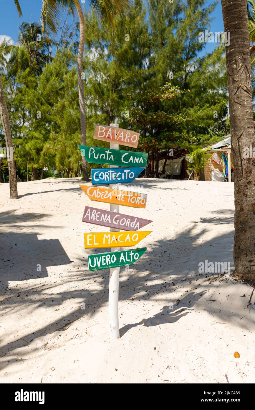 Dominican Republic Bavaro Punta Cana provinces La Altagracia. Wooden pillar with signposts directions Stock Photo