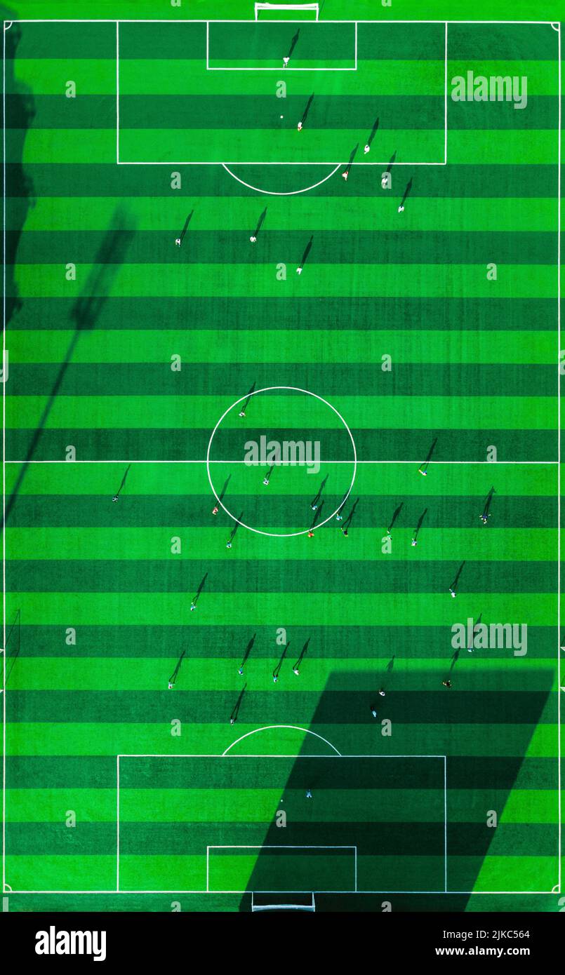 An aerial view of sport stadium of football with football players in ...